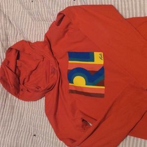 Red hooded long sleeve shirt